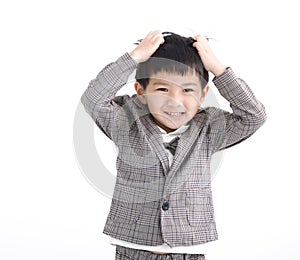 Asian boy feeling embarrassed and grabbing hair