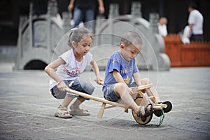 Asian boy and girl happy playing outside