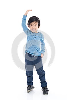 Asian Boy growing tall and measuring himself