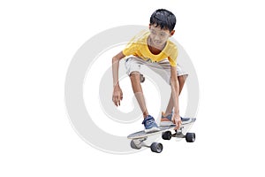 Asian boy having fun with surfboards or surf skate is relaxing lifestyle on holiday on white background.