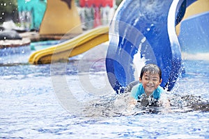 Asian boy having fun at swimming pool