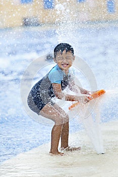 Asian boy having fun at a waterpark