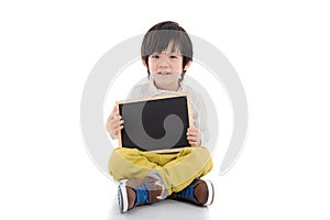 Asian boy holding black board on white background isolated