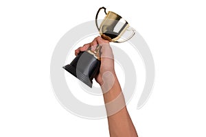 Asian boy holding a gold trophy cup for first place champion award isolated on white background.