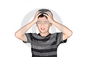 Asian boy kid holding his head frowning with screaming. pulling