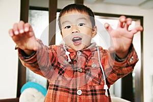 Asian boy look at his finger