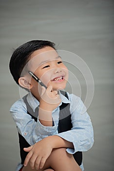 Asian boy, looking smart and intellectual, dressed sharp