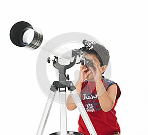 Asian boy looking through a telescope