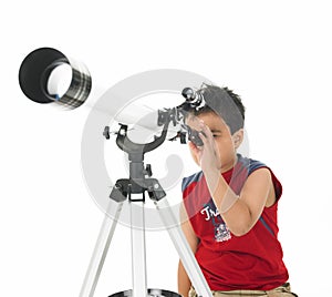 Asian boy looking through a telescope