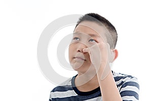 Asian boy Picking a booger on white