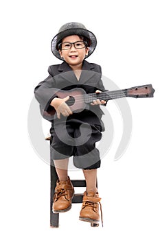 Asian boy playing guitar on isolated white background
