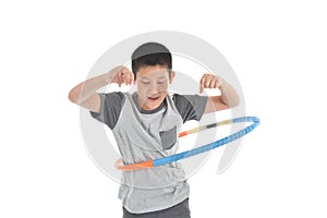 Asian boy playing with the hulahoop