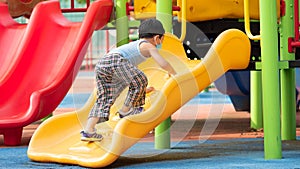 An asian boy playing outdoor activity with excited on something new