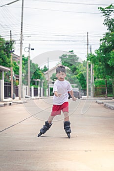 Asian boy is playing rollerblade