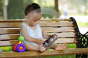 Asian boy playing toy