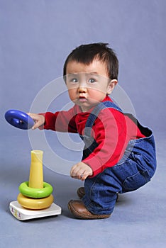Asian boy playing toy