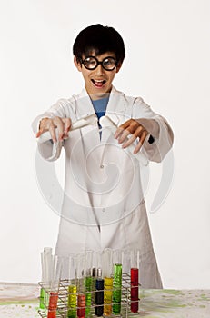 Asian boy pretending to be mad scientist
