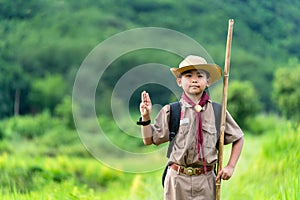 Asian boy Scout honor hand gesture