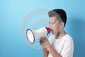 Asian boy shouting with megaphone