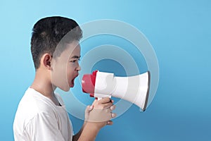 Asian boy shouting with megaphone