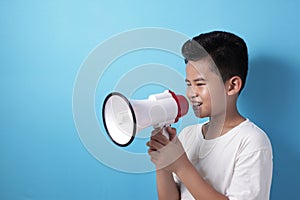 Asian boy shouting with megaphone