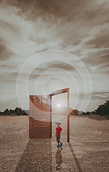 The Asian boy stand alone in front of the wood door in the demolition construction area at the sunset time with sunray an