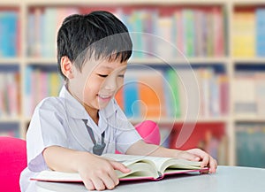 Asian boy student in school library