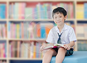 Asian boy student in school library