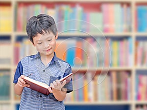 Asian boy student in school library