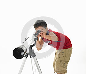 Asian boy with a telescope