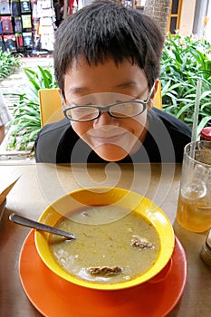 Asian boy trying street food