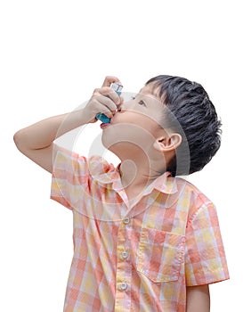 Asian boy using inhaler