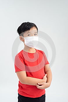 Asian boy wearing mouth mask against air Pollution atmosphere for protect from flu or disease healthcare concept