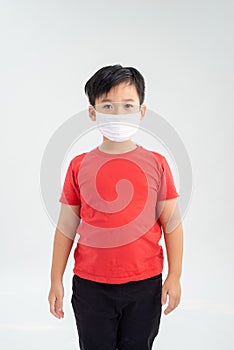 Asian boy wearing protective mask to protect pollution and the flu isolated on white background, Healthy concept