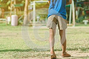 Asian boys practice kicking the ball to score goals