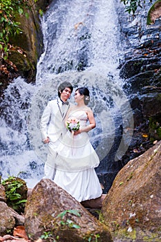 Asian Bride and Groom on Natural Background