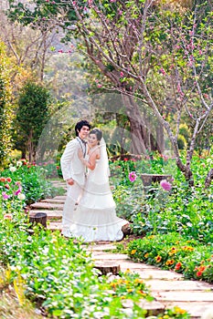 Asian Bride and Groom on Natural Background