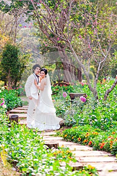 Asian Bride and Groom on Natural Background