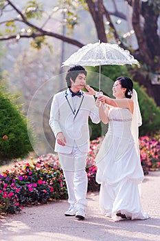 Asian Bride and Groom on Natural Background