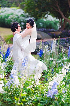 Asian Bride and Groom on Natural Background