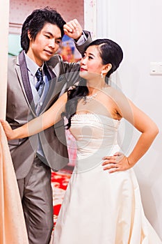 Asian Bride and Groom Standing in House