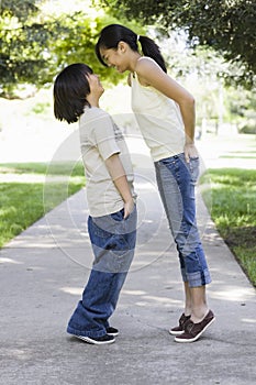 Asian Brother and Sister Looking at each Other