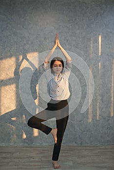 Asian business girl practicing yoga in the office. concept rela