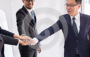 Asian business join hands success for dealing,Team work to achieve goals,Hand coordination