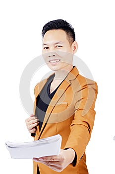 Asian business man in Brown suit portrait with giving book toward of Isolated on white backgrounds