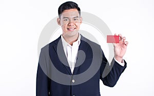 Asian business man holding credit card on white background