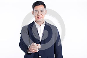 Asian business man pointing his finger and standing on white background