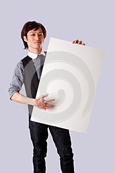 Asian business man pointing at white board