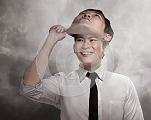 Asian business man remove his other face mask