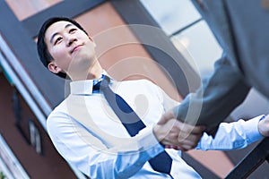 Asian Business Man Shake Hands with Another Business Man